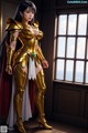 A woman in a golden armor standing in front of a window.