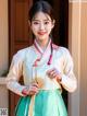 A woman in a green and white hanbok holding a fan.